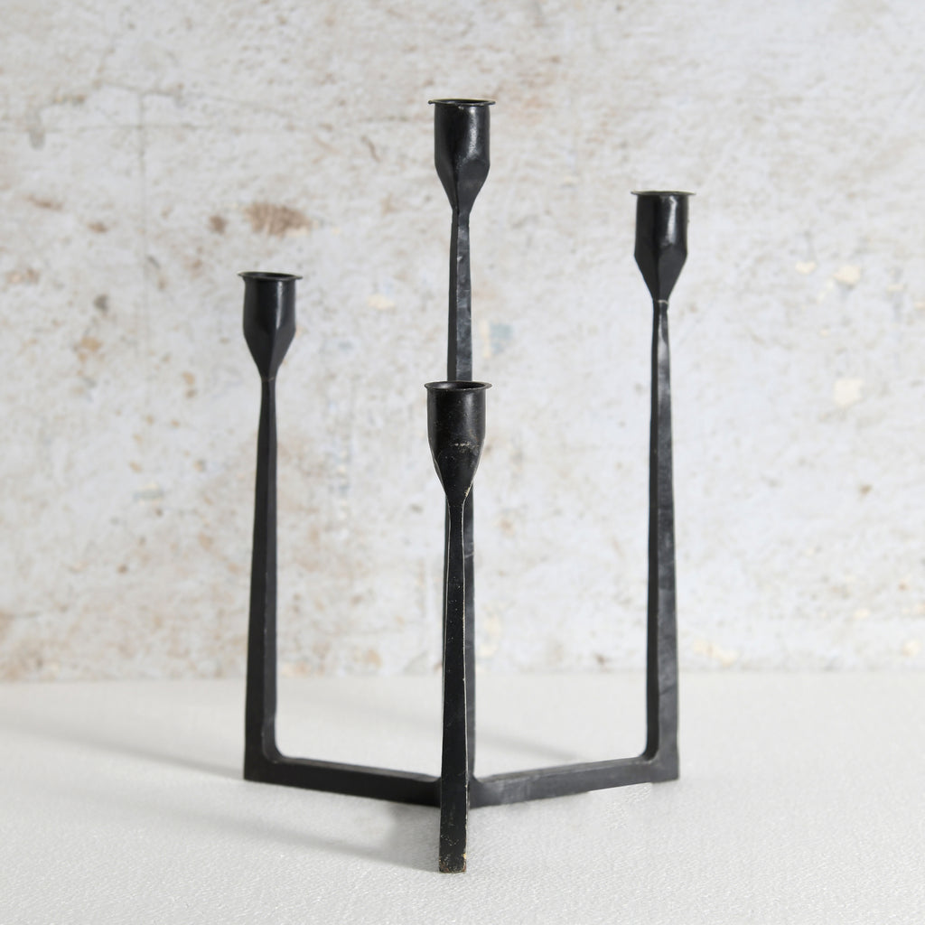 A black metal three-light candelabra with a minimalist, geometric design. Premium Home Decor
