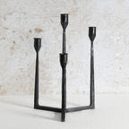 A black metal three-light candelabra with a minimalist, geometric design. Premium Home Decor