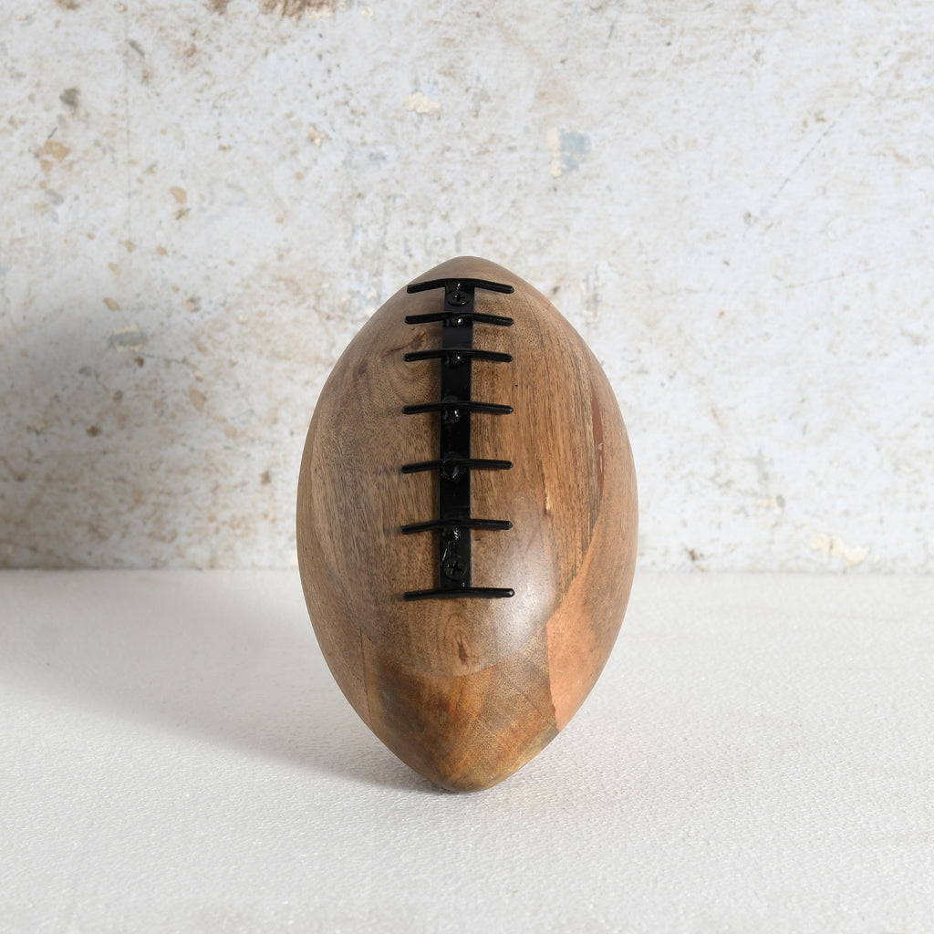 A wooden rugby shaped decor for living room shelf or side table.