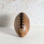 A wooden rugby shaped decor for living room shelf or side table.