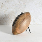 A wooden rugby shaped decor for living room shelf or side table.
