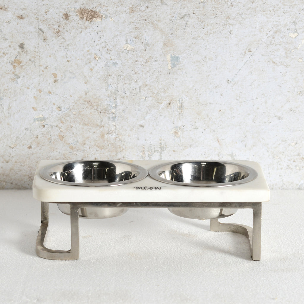 An elevated double pet feeder and water bowl stand with stainless steel bowls and legs.