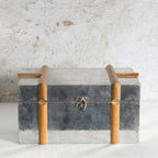 A vintage-style metal storage chest with a brushed silver-gray finish.