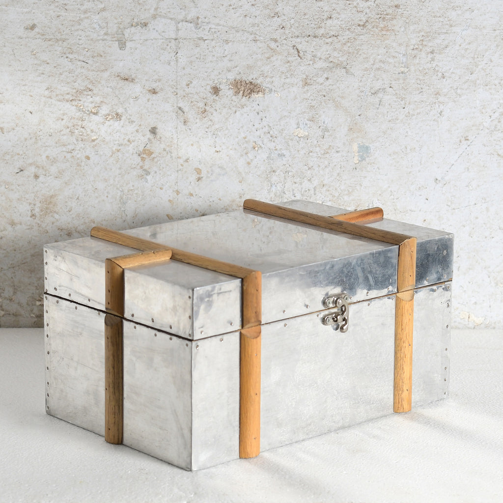 A rustic MDF & metal storage chest with a hammered silver finish.