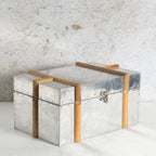 A rustic MDF & metal storage chest with a hammered silver finish.