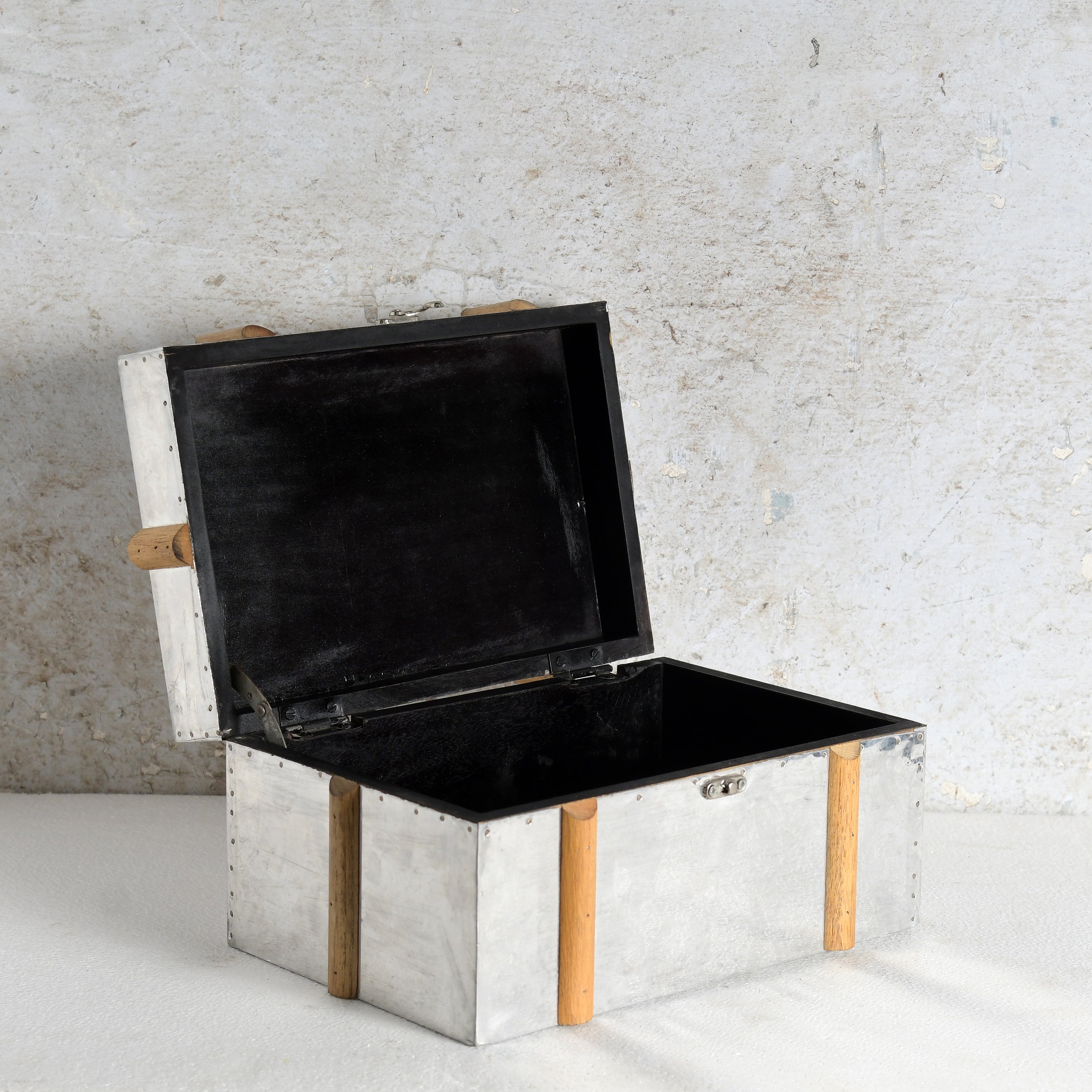 An open galvanized MDF & metal storage chest with a black lined interior.