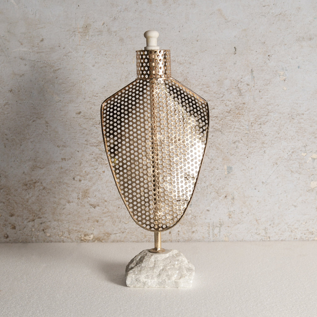 Iron jewellery stand with honeycomb texture.