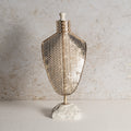Iron jewellery stand with honeycomb texture.
