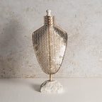 Iron jewellery stand with honeycomb texture.