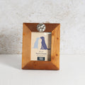 Wooden photo frame with a silver paw detailing