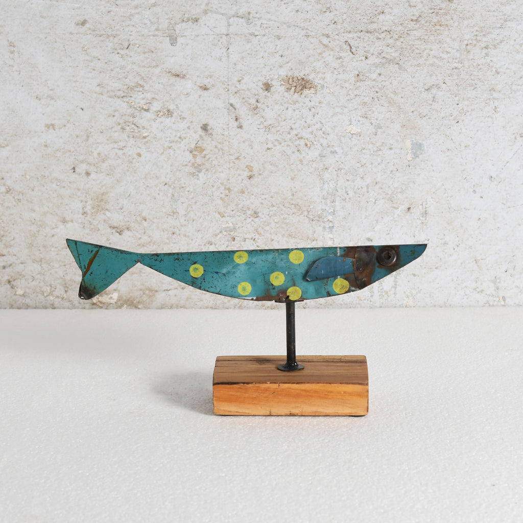 Iron fish sculpture with wooden stand