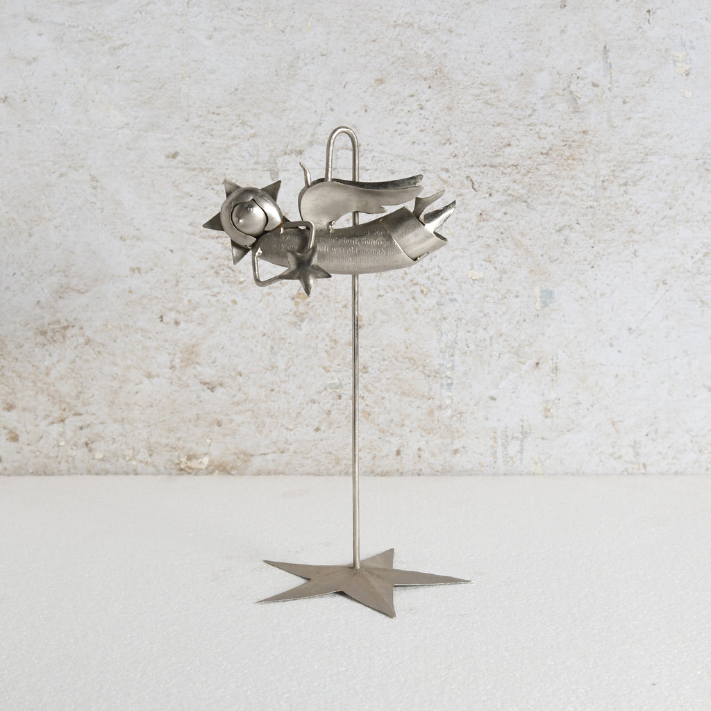 Iron fairy sculpture with a stand