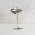 Iron fairy sculpture with a stand
