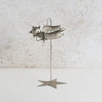 Iron fairy sculpture with a stand