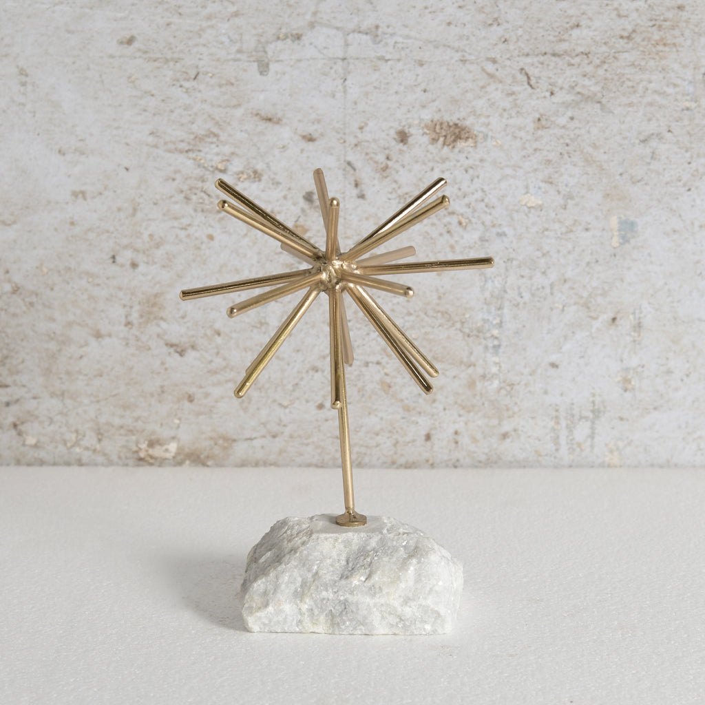 Gold starburst decor with white tone base