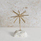 Gold starburst decor with white tone base