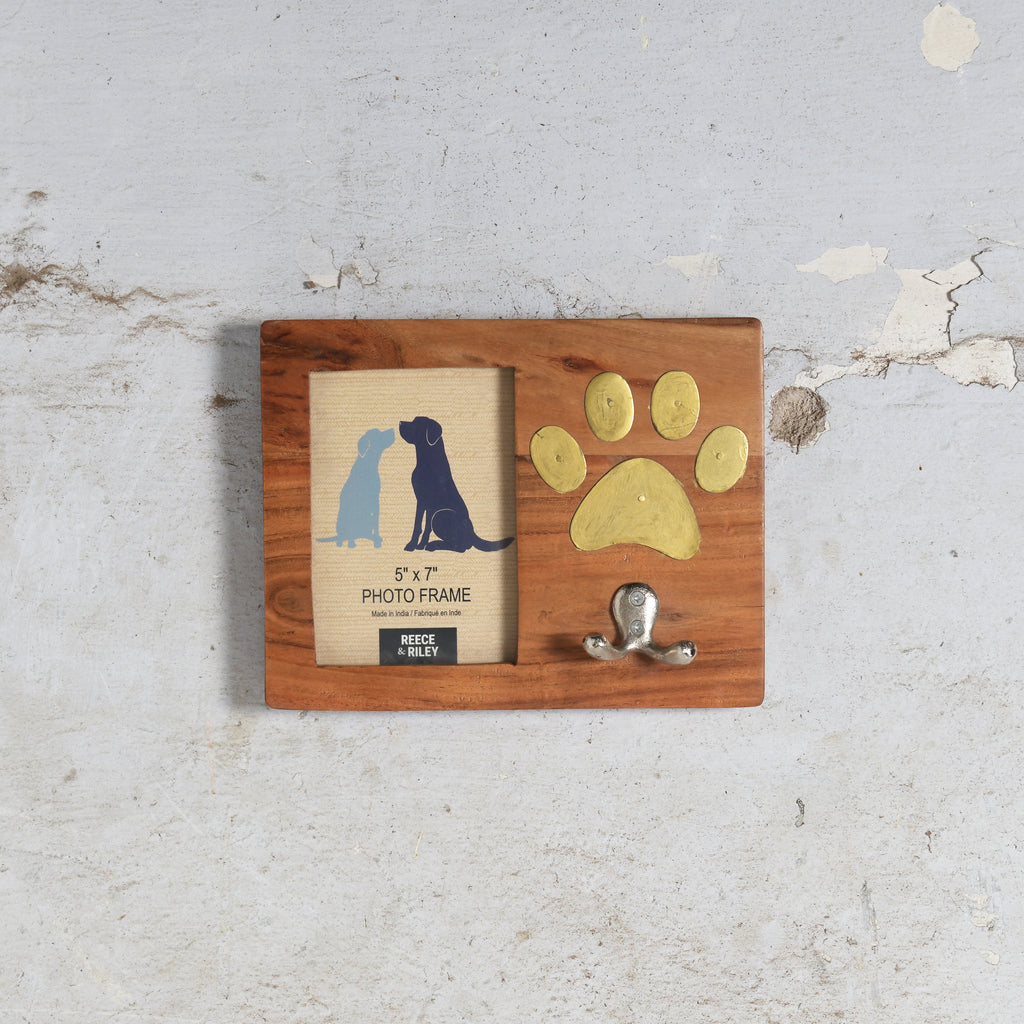 Wooden photo frame with a  paw print and a small hook mounted on plyobard