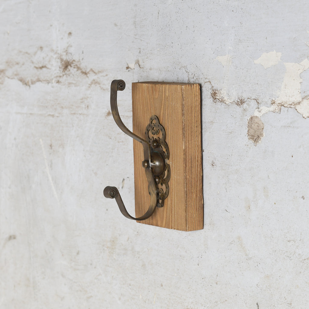 Wooden wall hook with metal brackets