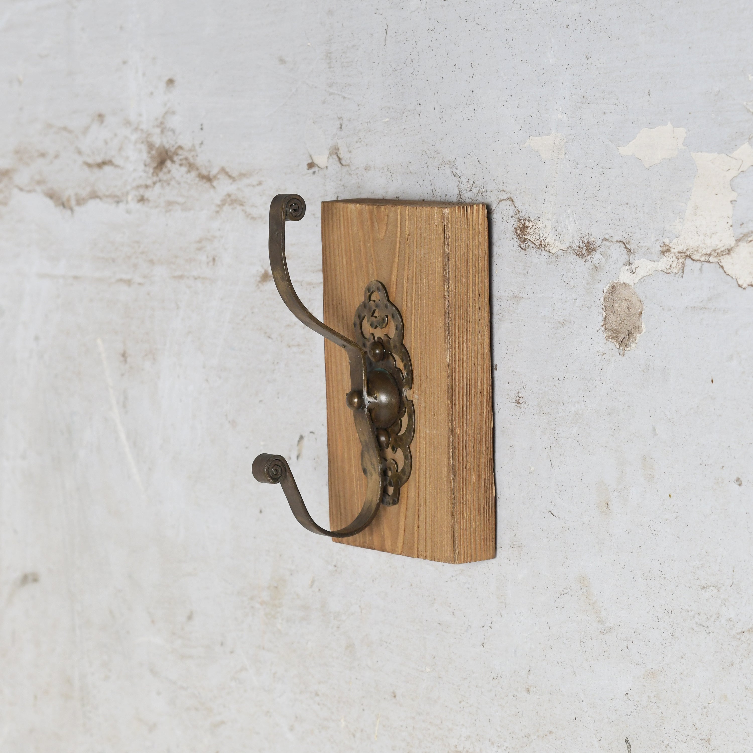 Wooden wall hook with metal brackets