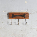 Wooden wall hanger with bone impresion
