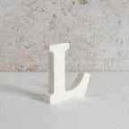 White marble letter L