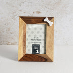 Wooden photo frame with a bone-shaped decorative element