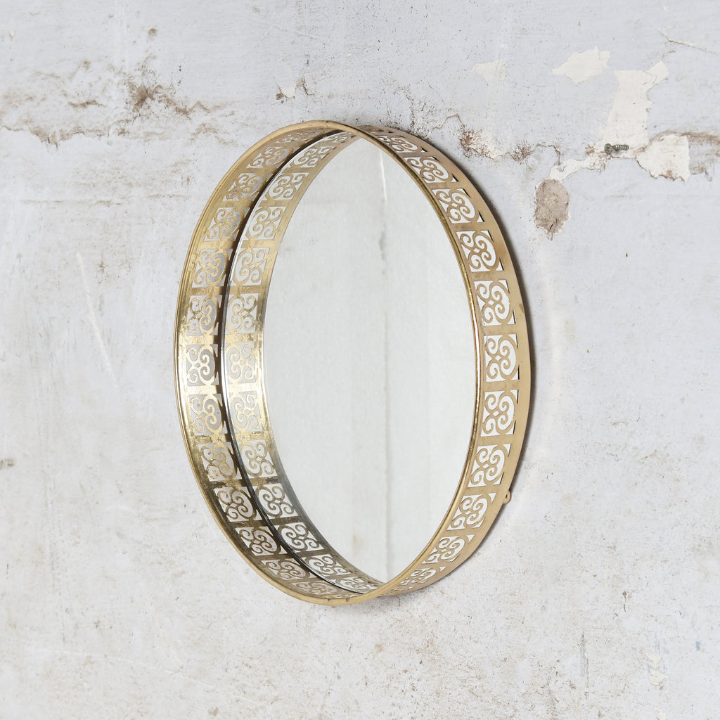 Iron wall mirror, could be used as tray also.