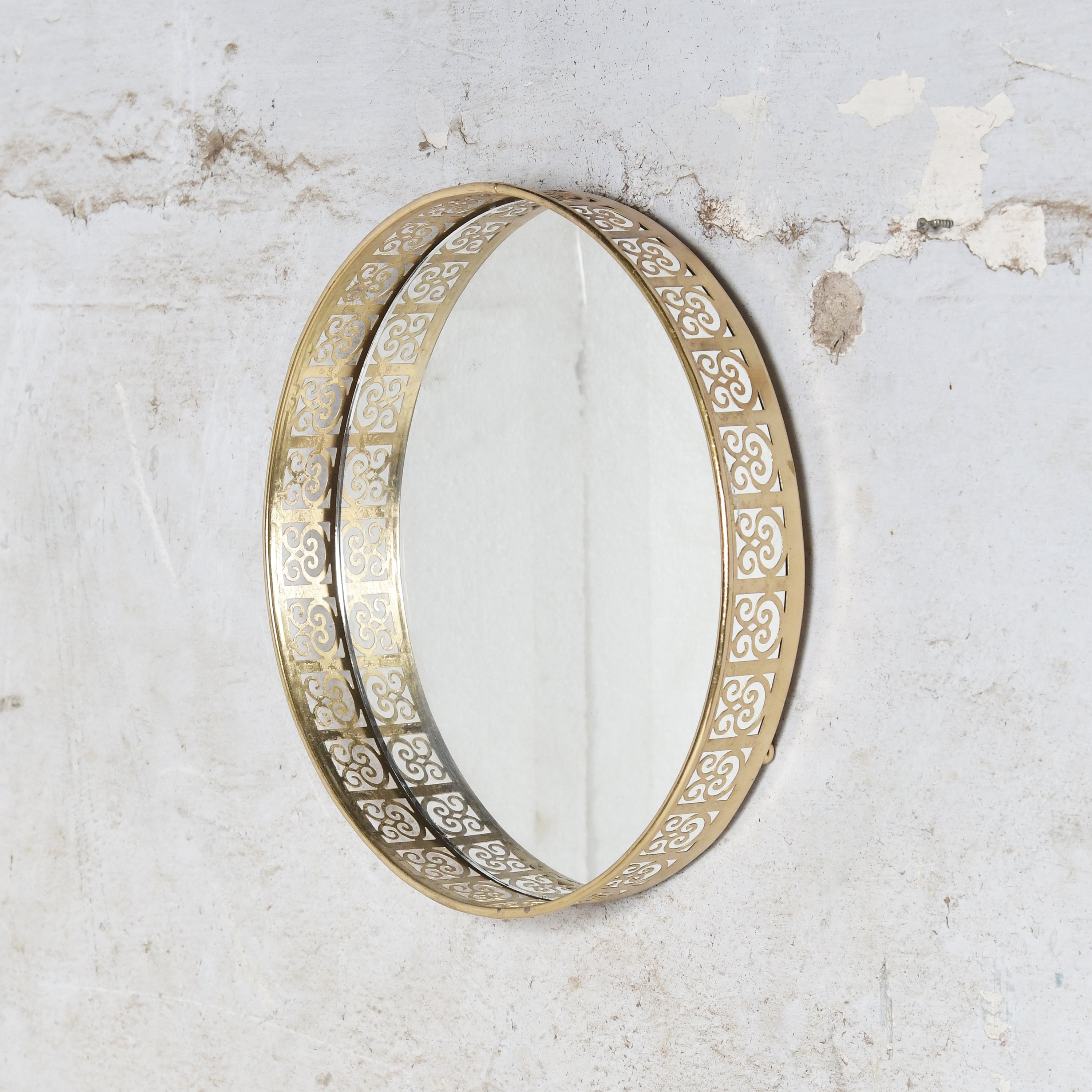 Iron wall mirror, could be used as tray also.